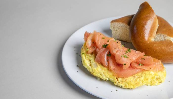 bagel with omelet and lox on the side